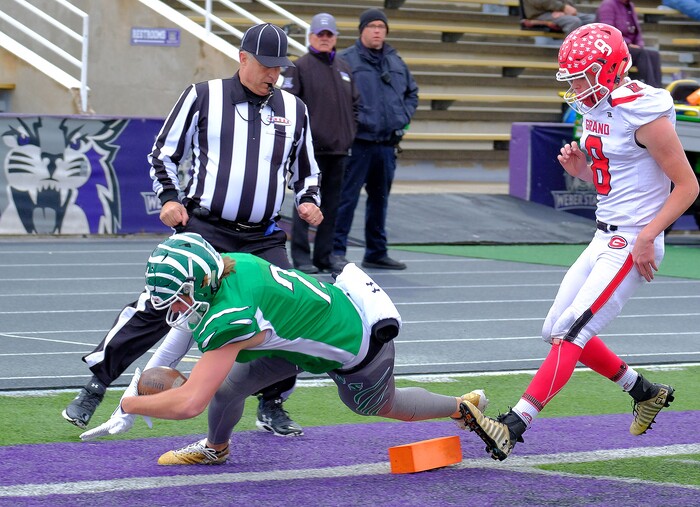 (Leah Hogsten  |  The Salt Lake Tribune) South Summit's Parker Grajek dives into the end zone for a touchdown. South Summit High School boys' football team leads Grand County High School 34-3 during their class 2A state semifinal football game Saturday, November 4, 2017 at Weber State University's Stewart Stadium.