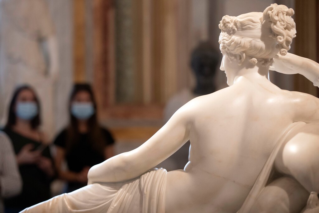 (Alessandra Tarantino | AP photo)
In this June 3 photo, women wearing face masks to prevent the spread of the coronavirus walk past the sculpture "Pauline Bonaparte as Venus Victrix," graven by Antonio Canova between 1805 and 1808, at the Galleria Borghese art gallery in Rome. Just as summer beckons, Europeans are re-inhabiting their cafes, parks and beaches abandoned during months of lockdown to check the spread of the coronavirus.