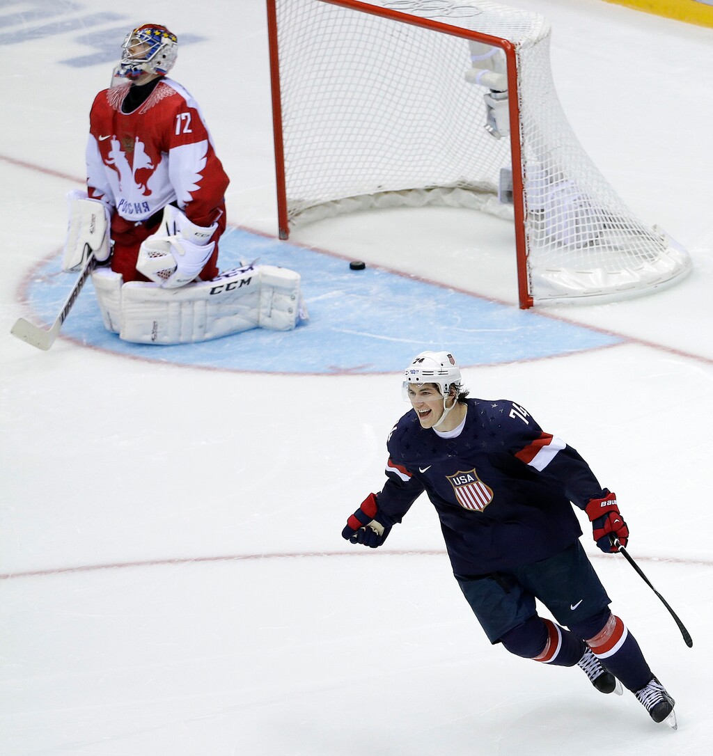USA forward T.J. Oshie reacts after scoring the winning goal against Russia goaltender Sergei Bobrovski in a shootout during overtime of a men's ice hockey game at the 2014 Winter Olympics in Sochi, Russia. (AP Photo/David J. Phillip, File)
