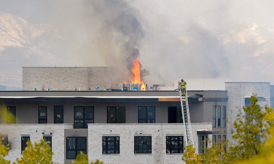 (Chris Samuels | The Salt Lake Tribune) Emergency crews continue to respond to a four-alarm fire in a new construction of apartment residences in Sugar House, Wednesday, Oct. 26, 2022.