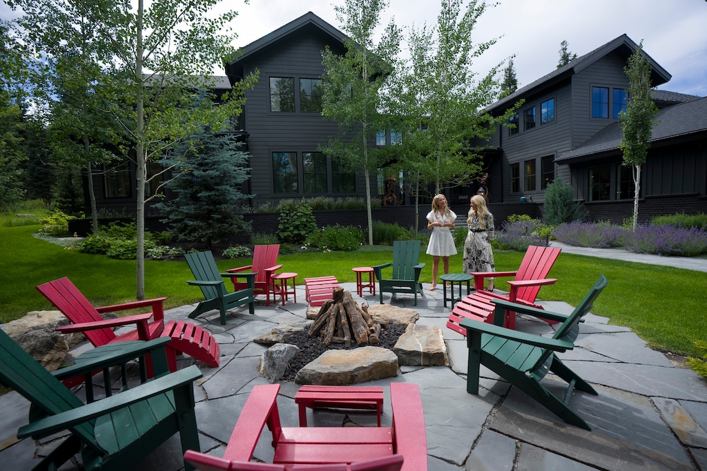 (Bethany Baker  |  The Salt Lake Tribune) Lacy Harrison, left, and Gretchen Hudgens from Summit Sotheby's International Realty pause next to a fire pit during a tour of a luxury home near Park City on Tuesday, July 7, 2026.