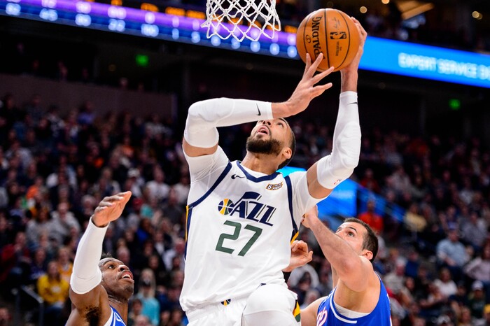 (Trent Nelson  |  The Salt Lake Tribune) Utah Jazz center Rudy Gobert (27) shoots flanked by Sacramento Kings guard Buddy Hield (24) and Sacramento Kings forward Nemanja Bjelica (88)  the Utah Jazz host the Sacramento Kings, NBA basketball in Salt Lake City on Saturday, Jan. 18, 2020.