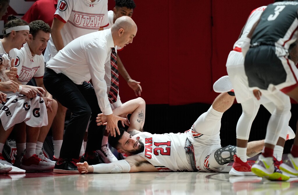 (Francisco Kjolseth | The Salt Lake Tribune) Utah Utes forward Dusan Mahorcic (21) ends up on the floor by his teammates while battling the Washington State Cougars at the Jon M.Huntsman Center earlier this month. Mahorcic has been suspended from the team indefinitely, the Utes announced Saturday.