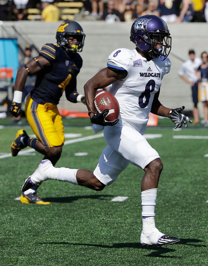 Weber State wide receiver Rashid Shaheed (8) runs past California linebacker Derron Brown (4) to score on a touchdown reception during the first half of an NCAA college football game in Berkeley, Calif., Saturday, Sept. 9, 2017. (AP Photo/Jeff Chiu)