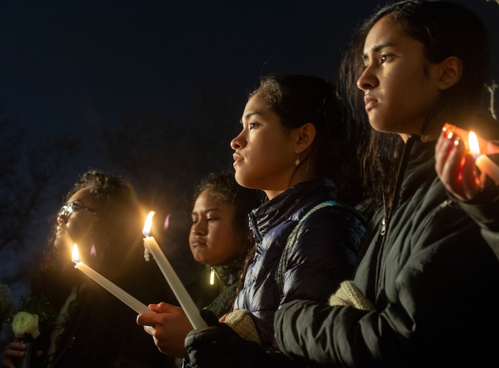 (Rick Egan  |  The Salt Lake Tribune)      BYU students gather for a candlelight vigil on BYU campus, for the student who died by suicide this week, at the Tanner Building, Friday, Dec. 7, 2018.
  
