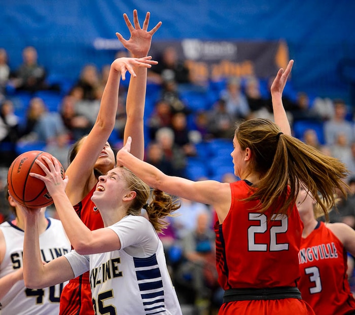 (Trent Nelson | The Salt Lake Tribune)  Springville's Mariah Skinner (22) defends Skyline's Madison Grange (25) as Skyline faces Springville in the 5A High School Girls' Basketball Tournament at SLCC in Taylorsville, Wednesday Feb. 21, 2018.
