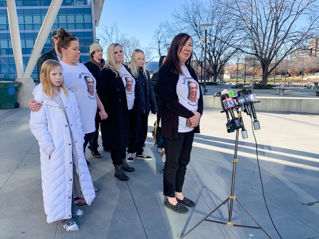 (Jordan Miller | The Salt Lake Tribune) Marilyn Stevenson, front, talks about her missing son, Justin Hooiman, with friends and family in front of the Salt Lake City Public Safety Building on Wednesday, December 8, 2021.