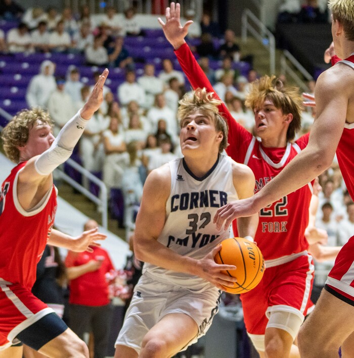 (Rick Egan | The Salt Lake Tribune) Max Toombs, Corner Canyon gets past the defenders for American Fork, in the Boys 6A State Championship at Weber State, on Saturday, March 4, 2023.