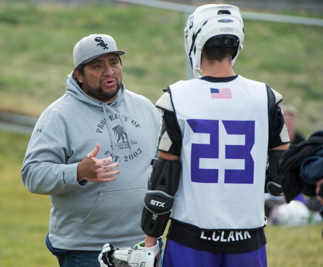 (Rick Egan | The Salt Lake Tribune) Box Elder lacrosse coach Juan Gaytan talks to player Logan Clark during a tournament in Logan on Saturday, Nov. 3, 2018.