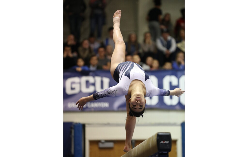 (Photo courtesy of Tyler Richardson | BYU) Angel Zhong competes in a gymnstics meet against Southern Utah, March 15, 2019.