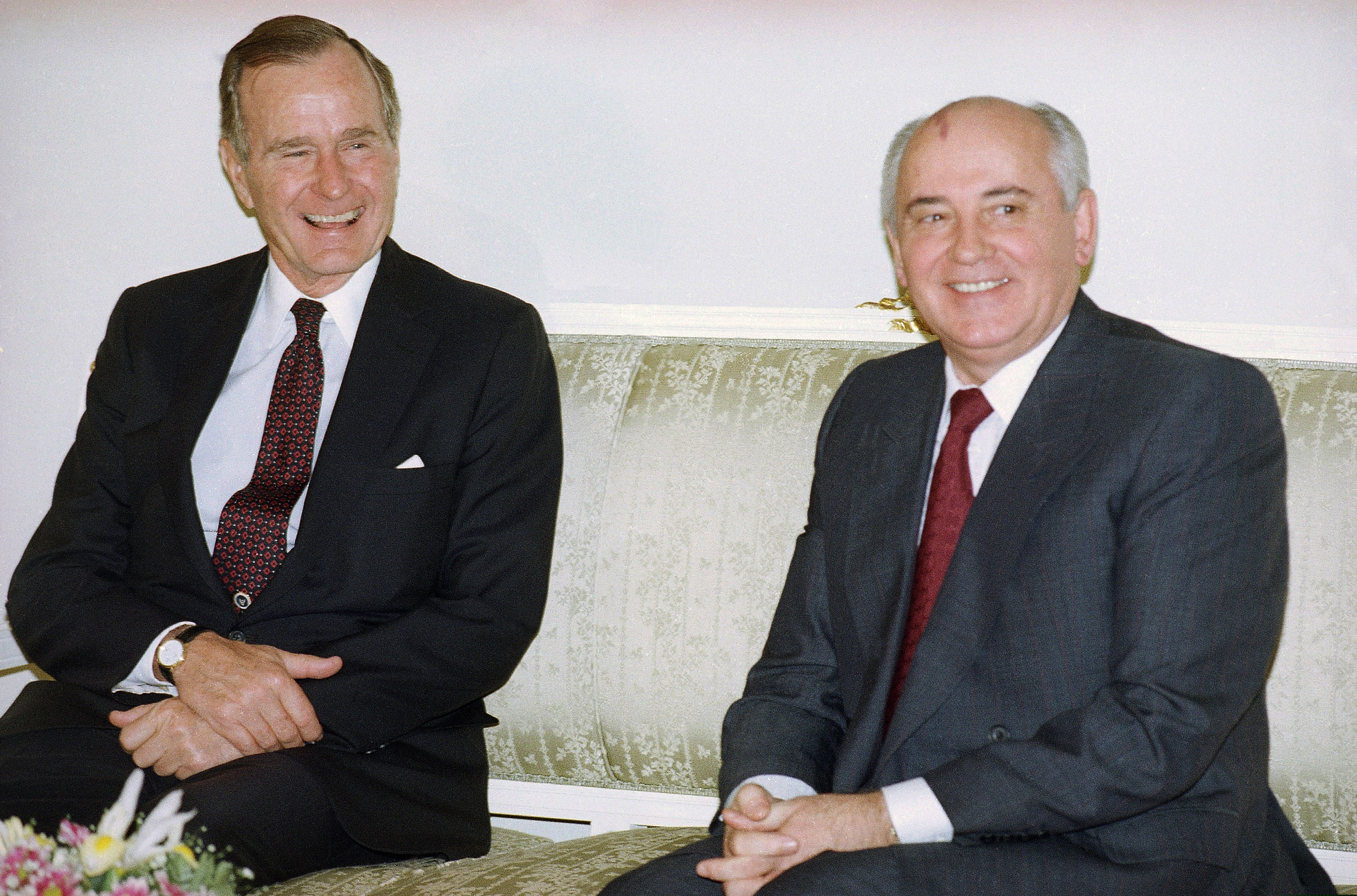 (Liu Heung Shing | The Associated Press) In this file photo taken on Tuesday, Oct. 29, 1991, U.S. President George H. Bush, left, and Soviet President Mikhail Gorbachev sit together at the Soviet Embassy after meeting in Madrid, Spain. Former Soviet premier Mikhail Gorbachev expressed his "deep condolences" Saturday Dec. 1, 2018, to the family of former U.S President George Bush and all Americans following his death, aged 94.