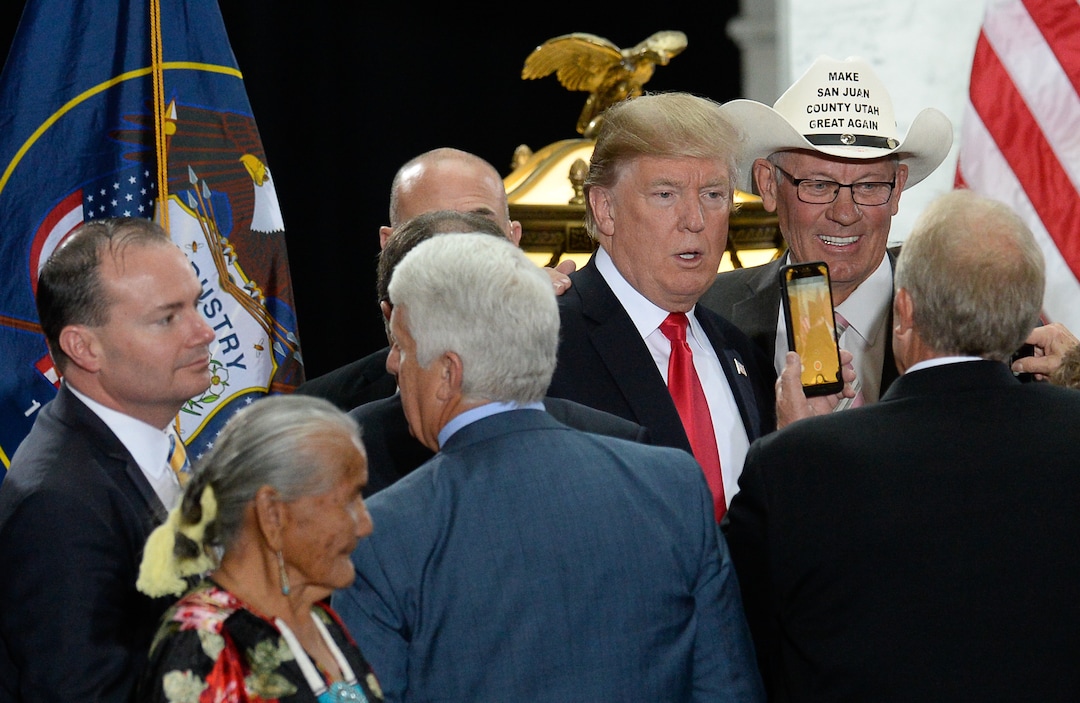 (Francisco Kjolseth  |  The Salt Lake Tribune)  Bruce Adams, right, Chairman of the San Juan County Commission has his picture taken with U.S. President Donald Trump at the Utah Capitol on Monday, Dec. 4, 2017, following the signing by Trump of two presidential proclamation to shrink Bears Ears and Grand Staircase-Escalante national monuments.