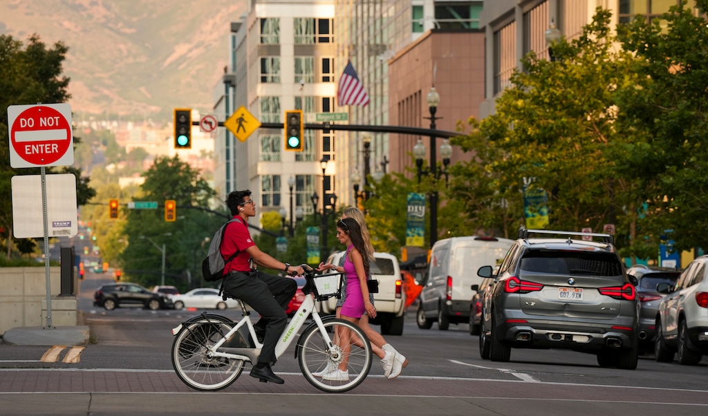 (Bethany Baker  |  The Salt Lake Tribune) People cross the intersection of East 100 South and Main Street in downtown Salt Lake City on Saturday, July 13, 2024.