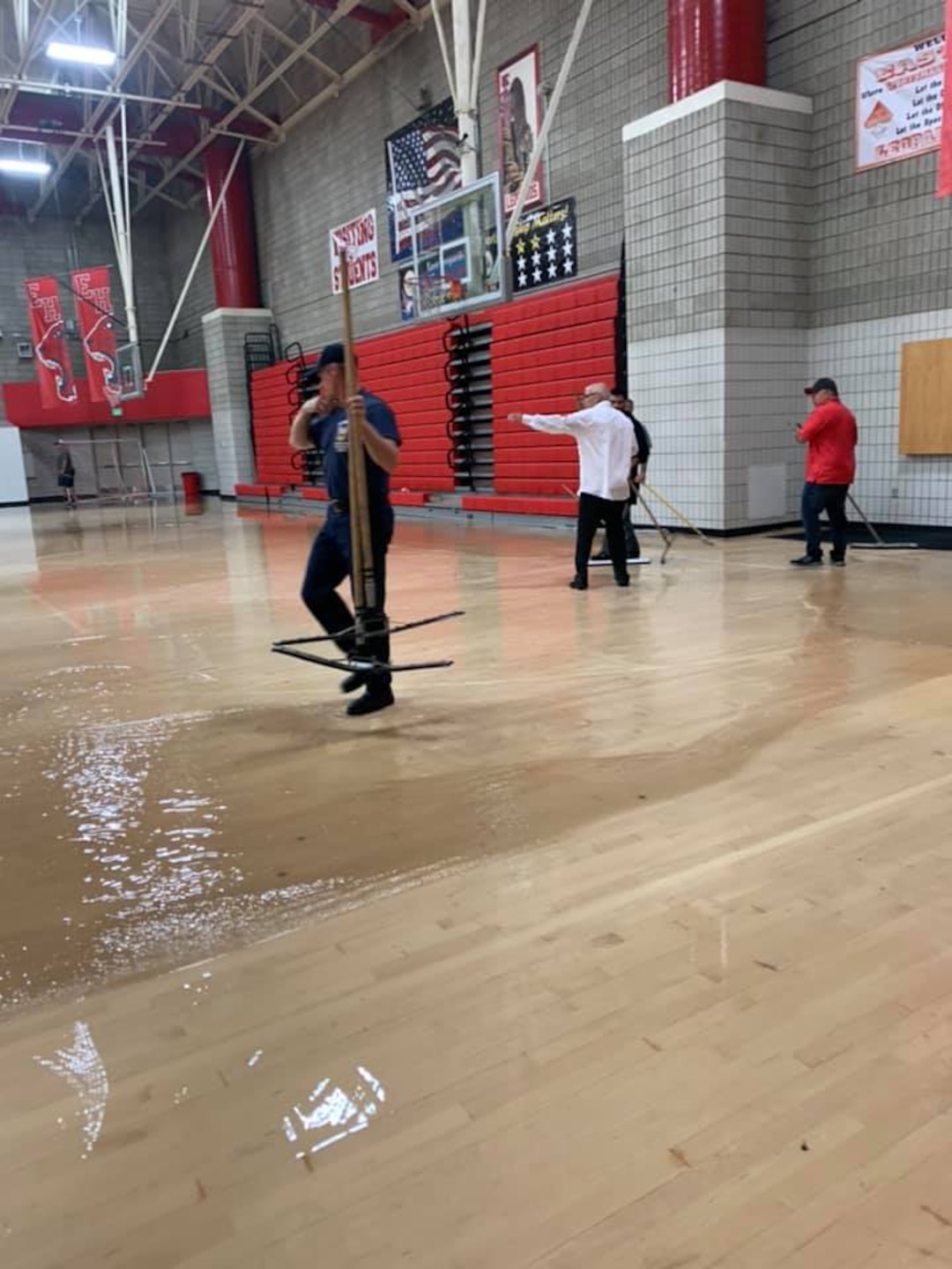 (Salt Lake City School District) The rainstorm that pounded Salt Lake City on Sunday, Aug. 2, 2021, flooded the basketball court at East High.
