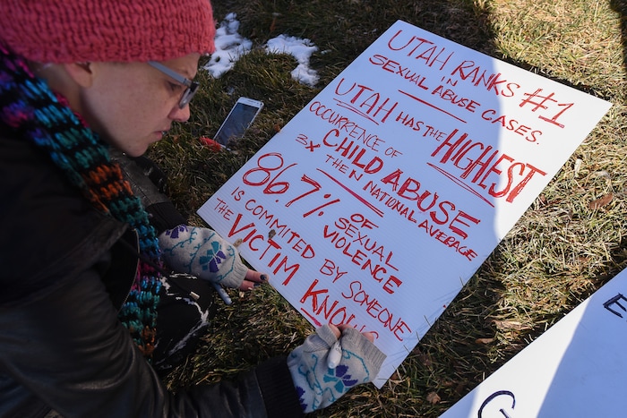 (Francisco Kjolseth | The Salt Lake Tribune) Shell Danis joins other activists in Utah to protest Salt City Tattoo on Friday, Dec. 22, 2017, following an Instagram post made by the shop's official Instagram account. The post in question was of a gift provided during the shop's white elephant exchange, a gift one of the artists at the parlor called a "rape kit," containing leather gloves, black duct tape, a bottle of lubricant, rope, and a knife.