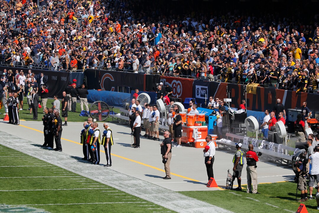 The Pittsburgh Steelers side of the field is nearly empty during the playing of he national anthem before an NFL football game, Sunday, Sept. 24, 2017, in Chicago. The Pittsburgh Steelers did not come out to the field during the anthem. (AP Photo/Charles Rex Arbogast)