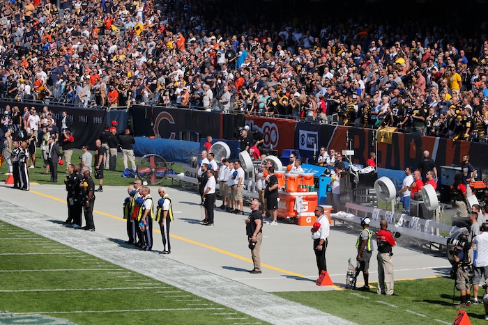 The Pittsburgh Steelers side of the field is nearly empty during the playing of he national anthem before an NFL football game, Sunday, Sept. 24, 2017, in Chicago. The Pittsburgh Steelers did not come out to the field during the anthem. (AP Photo/Charles Rex Arbogast)