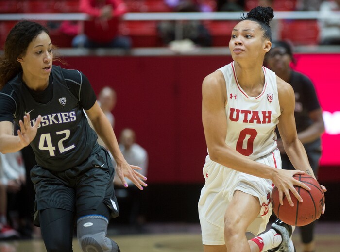 (Rick Egan  |  The Salt Lake Tribune)   Utah Utes guard Kiana Moore (0) brings the ball down court, as Washington Huskies guard Mackenzie Wieburg (42) defends, Sunday, Feb. 18, 2018.