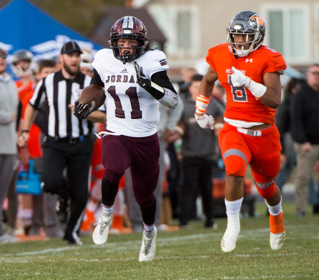 (Rick Egan  |  The Salt Lake Tribune)   Jordan running back Jake Shaver (11) runs for a touchdown, in prep 5A playoff action between Jordan High and Skyridge High, in Lehi, Friday, Nov. 2, 2018.