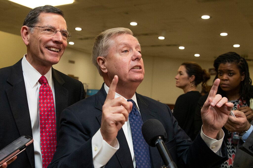 (Manuel Balce Ceneta | AP) Sen. Lindsey Graham, R-S.C., with Sen. John Barrasso, R-Wyo., speaks to reporters on Capitol Hill in Washington, Saturday, Jan. 25, 2020, the impeachment trial of President Donald Trump on charges of abuse of power and obstruction of Congress concluded for the day.