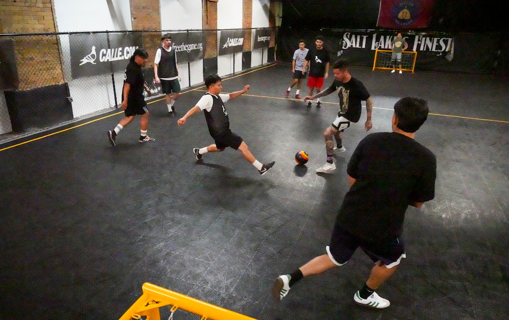 (Bethany Baker  |  The Salt Lake Tribune) People play street soccer on a smaller indoor court at Calle in Salt Lake City on Wednesday, June 26, 2024.