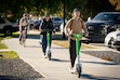 (Rick Egan | The Salt Lake Tribune) Scooters and bicyclists ride the bike trail along 900 South in the fall. The state has released a study of Salt Lake City's traffic-calming projects.