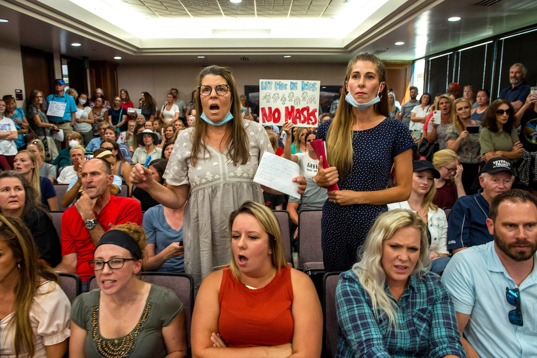 (Rick Egan  |  The Salt Lake Tribune)    Angry residents react when the Utah County Commission meeting was adjourned before it even started. The group protesting against masks being required in schools removed the social distancing tape on the chairs and filled the Utah County Commission room to over flowing, prompting Commissioner Tanner Ainge to call for a vote to adjourn the meeting in Provo, on Wednesday, July 15, 2020.