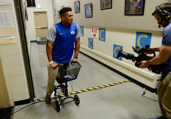 (Francisco Kjolseth  |  The Salt Lake Tribune)  Safeties coach Preston Hadley, nursing a broken leg is filmed as BYU hosts their eighth-annual football media day at the BYU-Broadcasting Building on Friday, June 22, 2018.