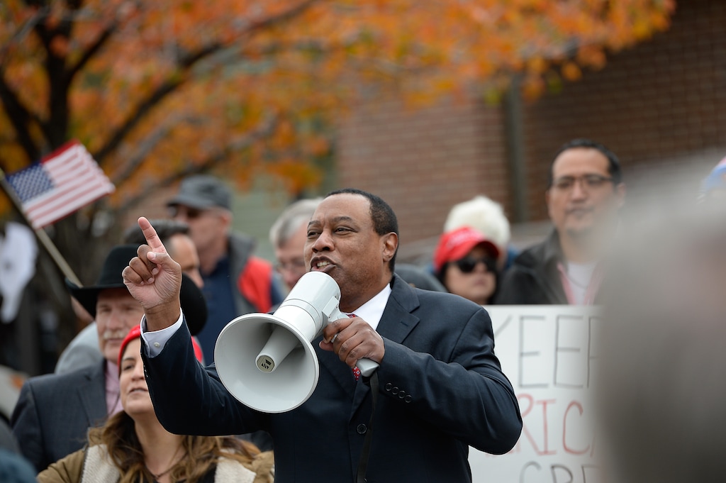 (Francisco Kjolseth | Tribune file photo) James Evans, former chair of the Utah Republican Party, uses a megaphone to excite chanting as two competing rallies spar near Rep. Ben McAdams' office in West Jordan, one seeking to support McAdams and one to criticize him for supporting the impeachment inquiry of President Donald Trump, on Wednesday, Oct. 9, 2019.