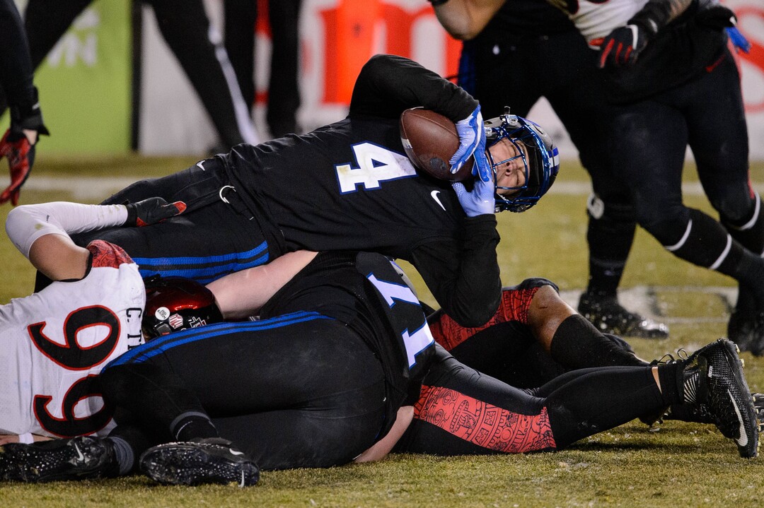 (Trent Nelson  |  The Salt Lake Tribune) Brigham Young Cougars running back Lopini Katoa (4) stretches out for more yardage as BYU hosts San Diego State, NCAA football in Provo on Saturday, December 12, 2020.
