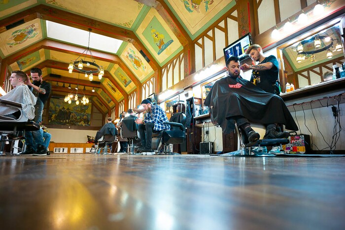 (Trent Nelson | The Salt Lake Tribune)
At right, Derek Neth styles Cal Cruz's hair at Ray's Barber Shop in Salt Lake City on Thursday Feb. 28, 2019.