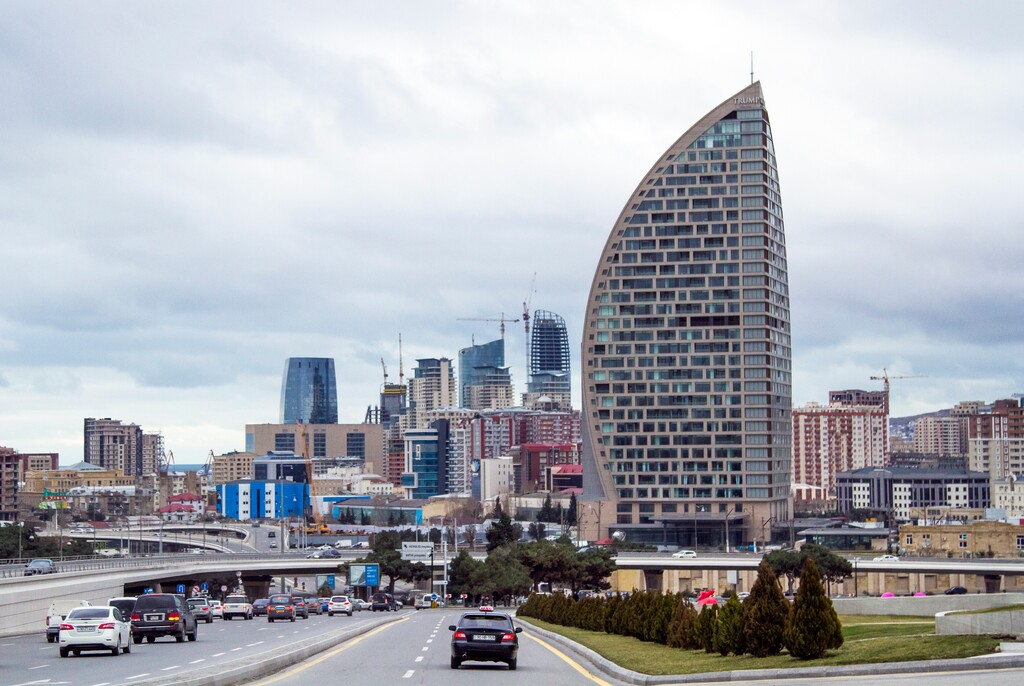 FILE - In this Feb. 19, 2016, file photo, The Trump International Hotel, the highest building, is seen in Baku, Azerbaijan. Just six months before he launched his presidential campaign, Donald Trump announced a new real estate project in Baku. The partner: the 35-year-old son of an Azerbaijani minister suspected by U.S. diplomats of corruption and laundering money for Irans military and described by them as notoriously corrupt. Now, only weeks after Ivanka Trump released a publicity video of the nearly finished project, references to the Baku project have disappeared from Trumps website. (AP Photo/Aida Sultanova, File)