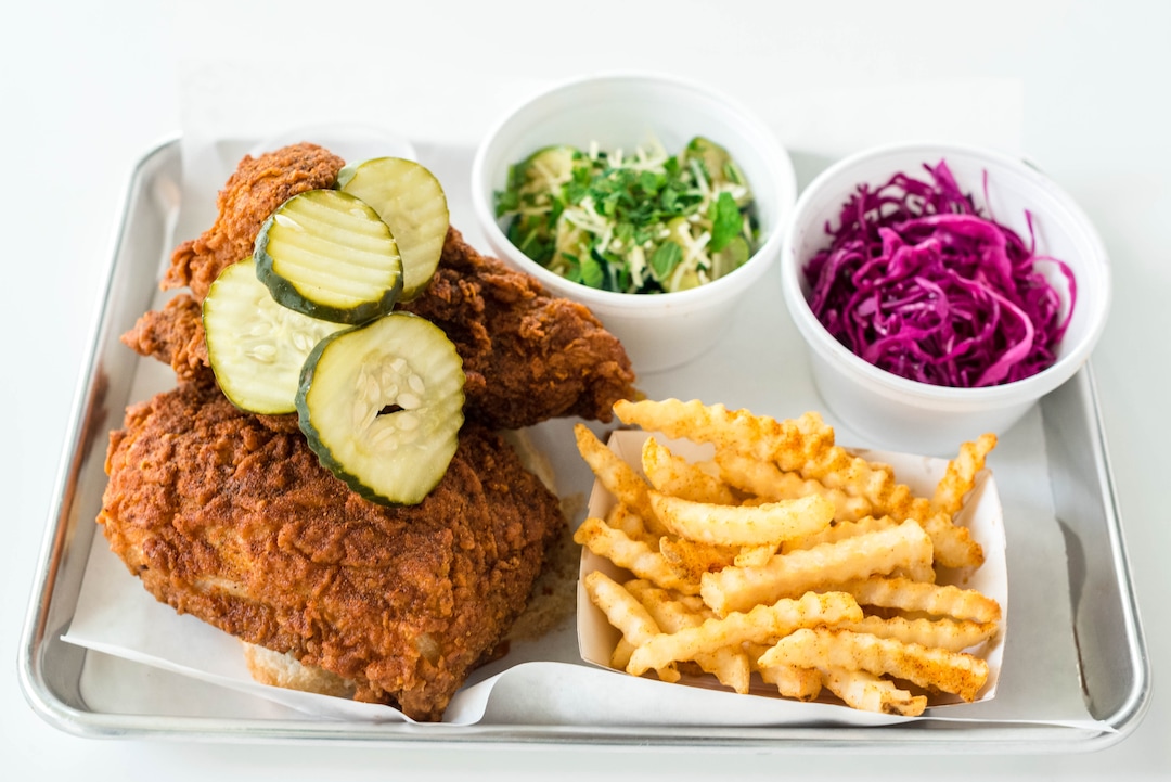 (Billy Yang | Pretty Bird) Nashville-style hot chicken with sides at Pretty Bird in Salt Lake City.