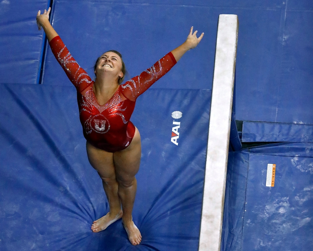 Utah's Maddy Stover smiles after completing her routine on the balance beam during the NCAA college women's gymnastics championships Friday, April 14, 2017, in St. Louis. (AP Photo/Jeff Roberson)