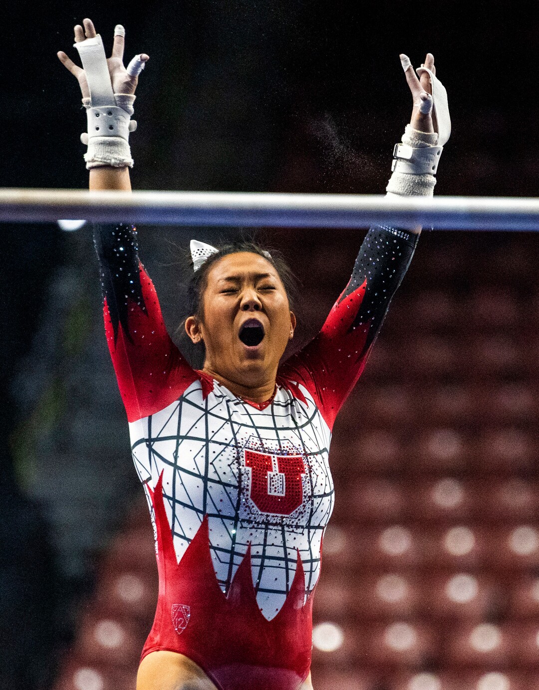 (Rick Egan | The Salt Lake Tribune) Cristal Isa reacts after competing on the uneven bars, for Utah, in the PAC-12 Championships at the Maverik Center, onSaturday, March 20, 2021.