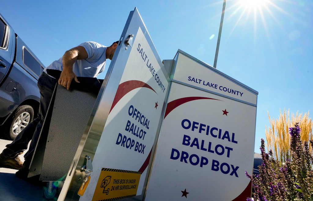 (Francisco Kjolseth | The Salt Lake Tribune) Election officials pick up a load of ballots at the Granite Library during primary voting Tuesday, Sept. 5, 2023.