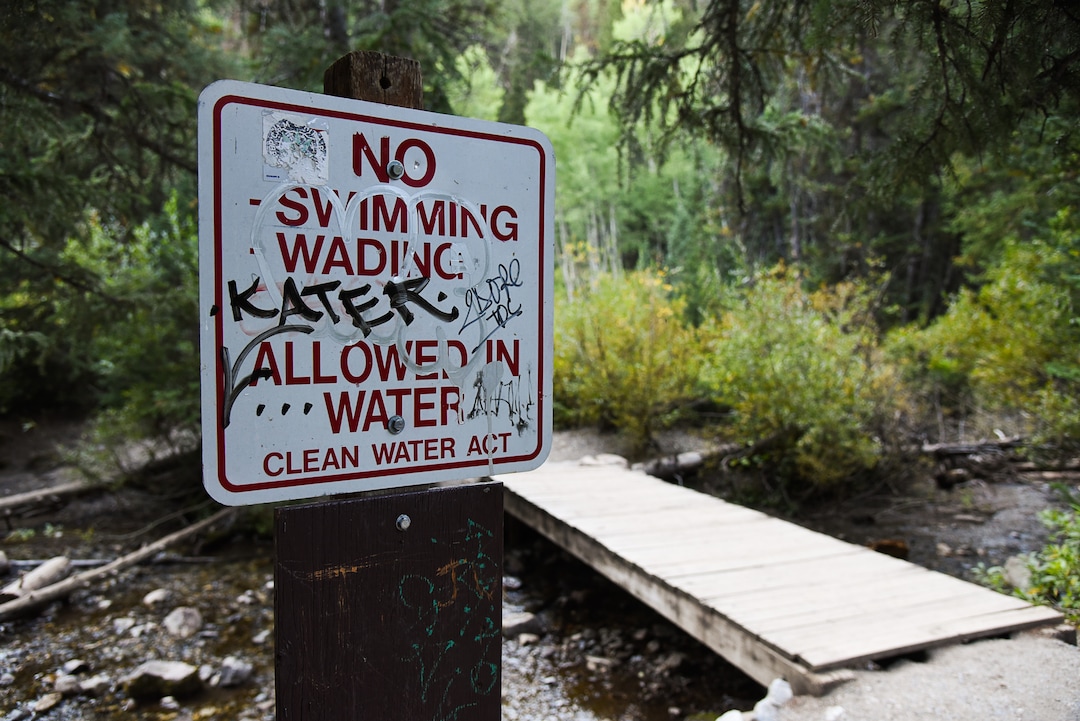 (Francisco Kjolseth  |  The Salt Lake Tribune)  Graffiti  is apparent on most signs along the popular Donut Falls trail on Friday, Aug. 31, 2018, in Big Cottonwood Canyon which draws regular crowds.