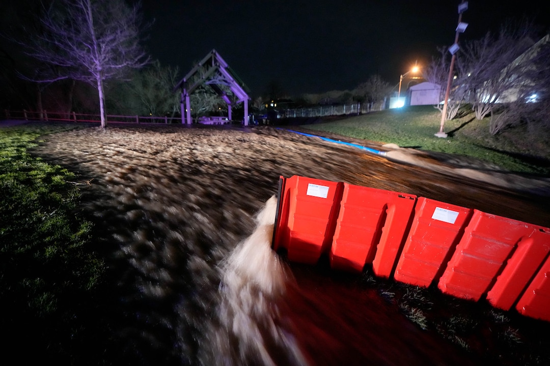 (Francisco Kjolseth | The Salt Lake Tribune) Heavy flow spills over Wasatch Hollow Park in Salt Lake City as peak flow from Emigration Creek continues to rise into the night on Wednesday, April 12, 2023. 