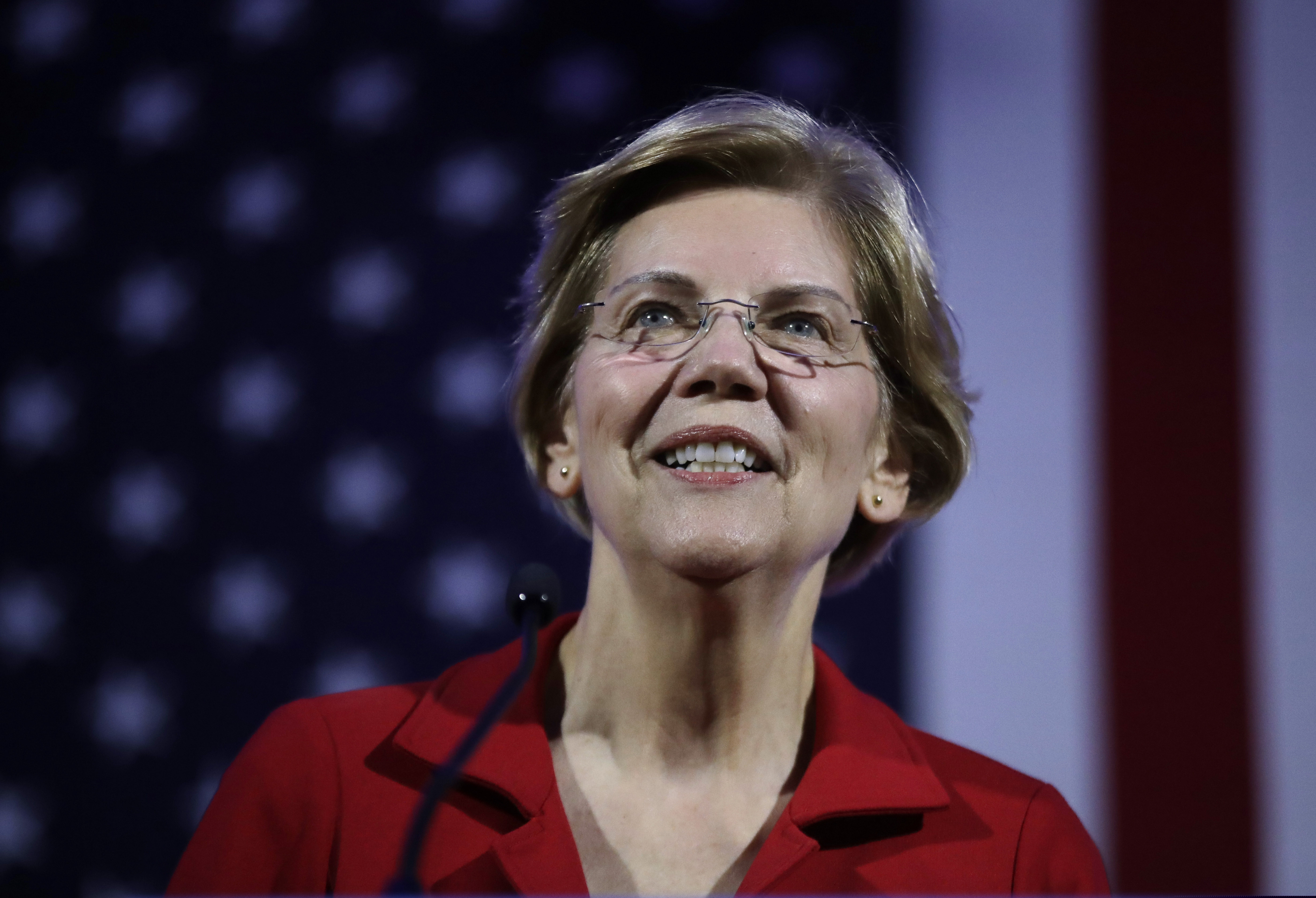 In this Feb. 22, 2019, photo, Democratic presidential candidate Sen. Elizabeth Warren, D-Mass., speaks at the New Hampshire Democratic Party's 60th Annual McIntyre-Shaheen 100 Club Dinner in Manchester, N.H. Several Democratic presidential candidates are embracing reparations for the descendants of slaves _ but not in the traditional sense. Over the past week, Senators Kamala Harris, Elizabeth Warren and former Obama cabinet secretary Julian Castro spoke of the need for the U.S. government to reckon with and make up for slavery. But instead of backing the direct compensation for African-Americans, they are talking about more universal policies that would also benefit blacks. (AP Photo/Elise Amendola)