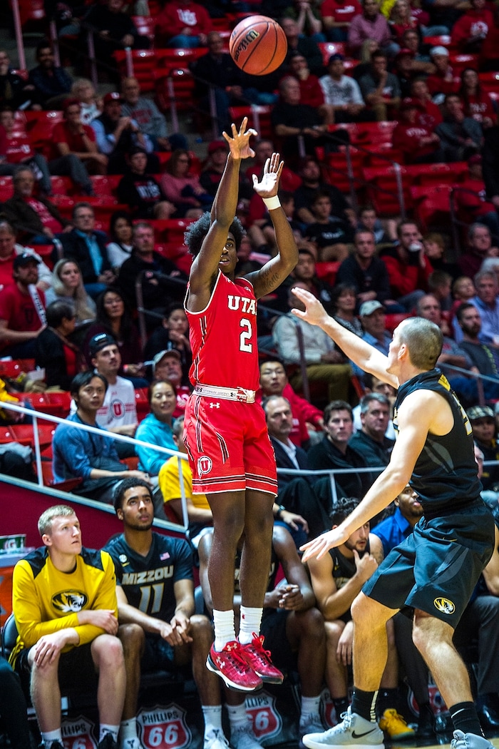 (Chris Detrick  |  The Salt Lake Tribune)  Utah Utes guard Kolbe Caldwell (2) shoots past Missouri Tigers guard Cullen VanLeer (33) during the game at the Jon M. Huntsman Center Thursday, November 16, 2017.   