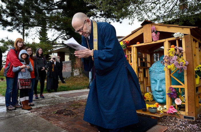 (Scott Sommerdorf | The Salt Lake Tribune)
Sensei from The Salt Lake Buddhist Fellowship, Christopher Kakuyo Ross-Leibow, bows during the rededication ceremony for the Buddha on 9th, the Sugar House landmark and Buddhist Shrine, Sunday, April 8, 2018.