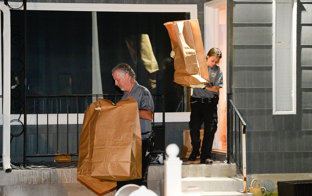 (Francisco Kjolseth | Tribune file photo)  Police investigators remove multiple bags of evidence during their search of a home at 547 N. 1000 West in Salt Lake City as part of the disappearance of University of Utah student MacKenzie Lueck that carried on into the early morning hours of Thursday, June 27, 2019.