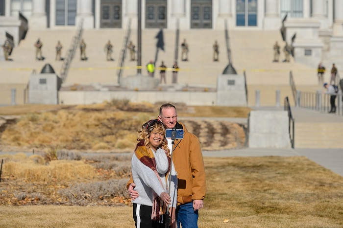 (Trent Nelson | The Salt Lake Tribune) A pair of tourists who didn't want to give their names pose for a selfie with National Guard troops guarding the state Capitol in Salt Lake City on Sunday, Jan. 17, 2021.