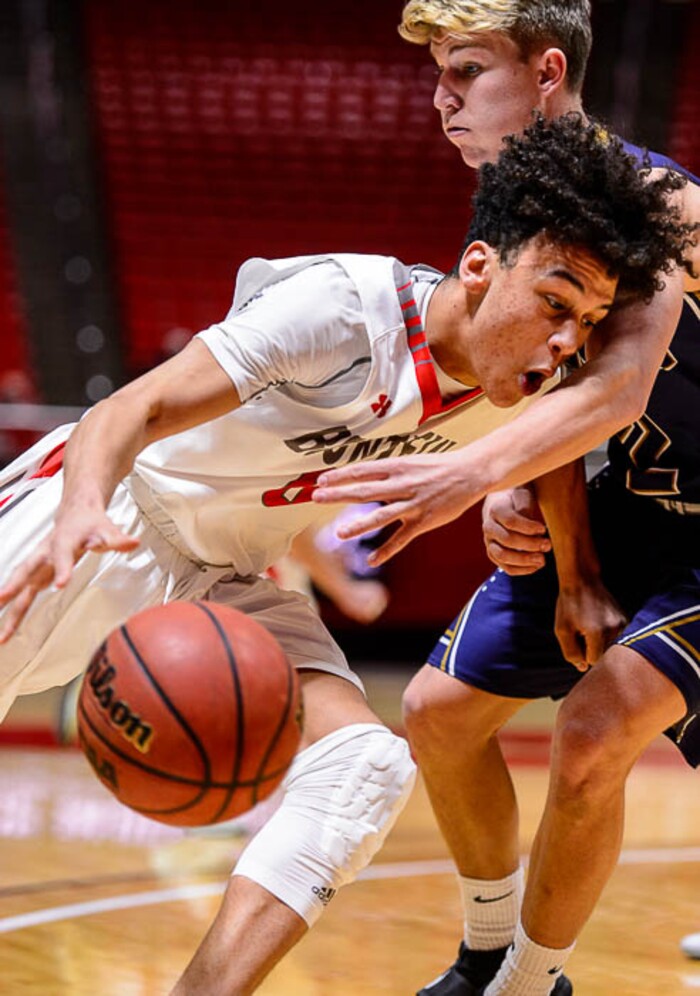 (Trent Nelson | The Salt Lake Tribune)  Skyline vs. Bountiful, 5A State high school basketball tournament at the Huntsman Center in Salt Lake City, Wednesday Feb. 28, 2018. Bountiful's Isaac Kime (0) drives on Skyline's Briggs Binford (2).