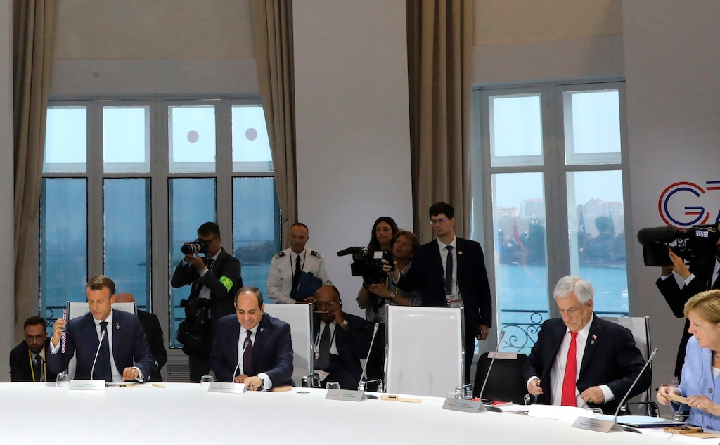 (Ludovic Marin | AP) From the left, French President Emmanuel Macron, Egyptian President and Chairman of the African Union Abdel Fattah al-Sissi, Chile's President Sebastian Pinera and German Chancellor Angela Merkel attend a work session focused on climate in Biarritz, southwestern France, Monday Aug. 26, 2019, on the third day of the annual G7 Summit. The empty seat at third right was the place reserved for President Donald Trump, who according to Macron had skipped Monday’s working session on the climate. At the same time Macron said that Trump supported an initiative by G-7 countries for an immediate $20 million fund to help Amazon countries fight wildfires and launch a long-term global initiative to protect the rainforest.