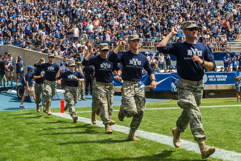 (Chris Detrick  |  The Salt Lake Tribune)  Members of the BYU Army ROTC run onto the field during the game at LaVell Edwards Stadium Saturday, August 26, 2017.