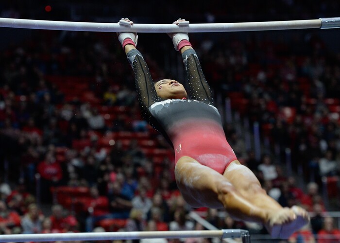 (Francisco Kjolseth  |  The Salt Lake Tribune)  Kim Tessen performs her routine on the bars as Utah hosts Penn State in their season opener at the Huntsman Center in Salt Lake City on Saturday, Jan. 5, 2019.