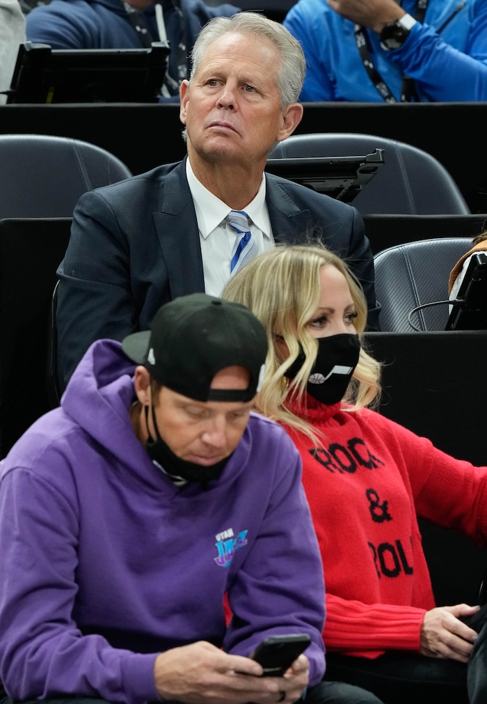 (Francisco Kjolseth | The Salt Lake Tribune) Former BYU basketball player Danny Ainge, top, who was just named CEO of the Utah Jazz, sits next to Jazz owner Ryan Smith and his wife Ashley during the Jazz game against the LA Clippers at Vivint Smart Home Arena on Wednesday, Dec. 15, 2021.