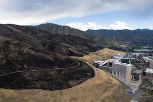 (Francisco Kjolseth | The Salt Lake Tribune) The Bonneville Fire burn scar behind the Huntsman Cancer Center in Salt Lake City on Thursday, June 25, 2026. Utah's capital is banning fireworks citywide this July Fourth in light of an executive order by Gov. Spencer Cox.