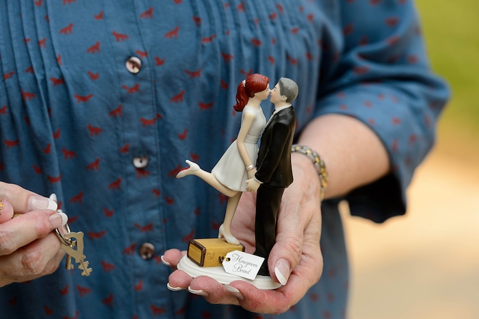(Trent Nelson | The Salt Lake Tribune)  Carolyn Jacobson holds an ornament from her wedding while evacuating her home as a fire burns at the mouth of Weber Canyon, Tuesday September 5, 2017.